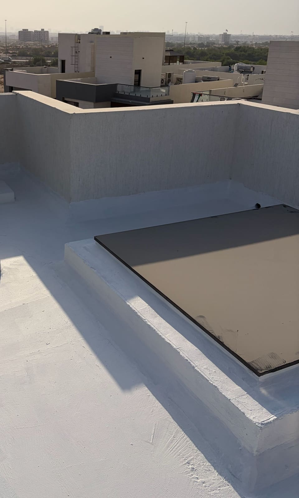 White waterproof coating around a roof skylight, Ajman