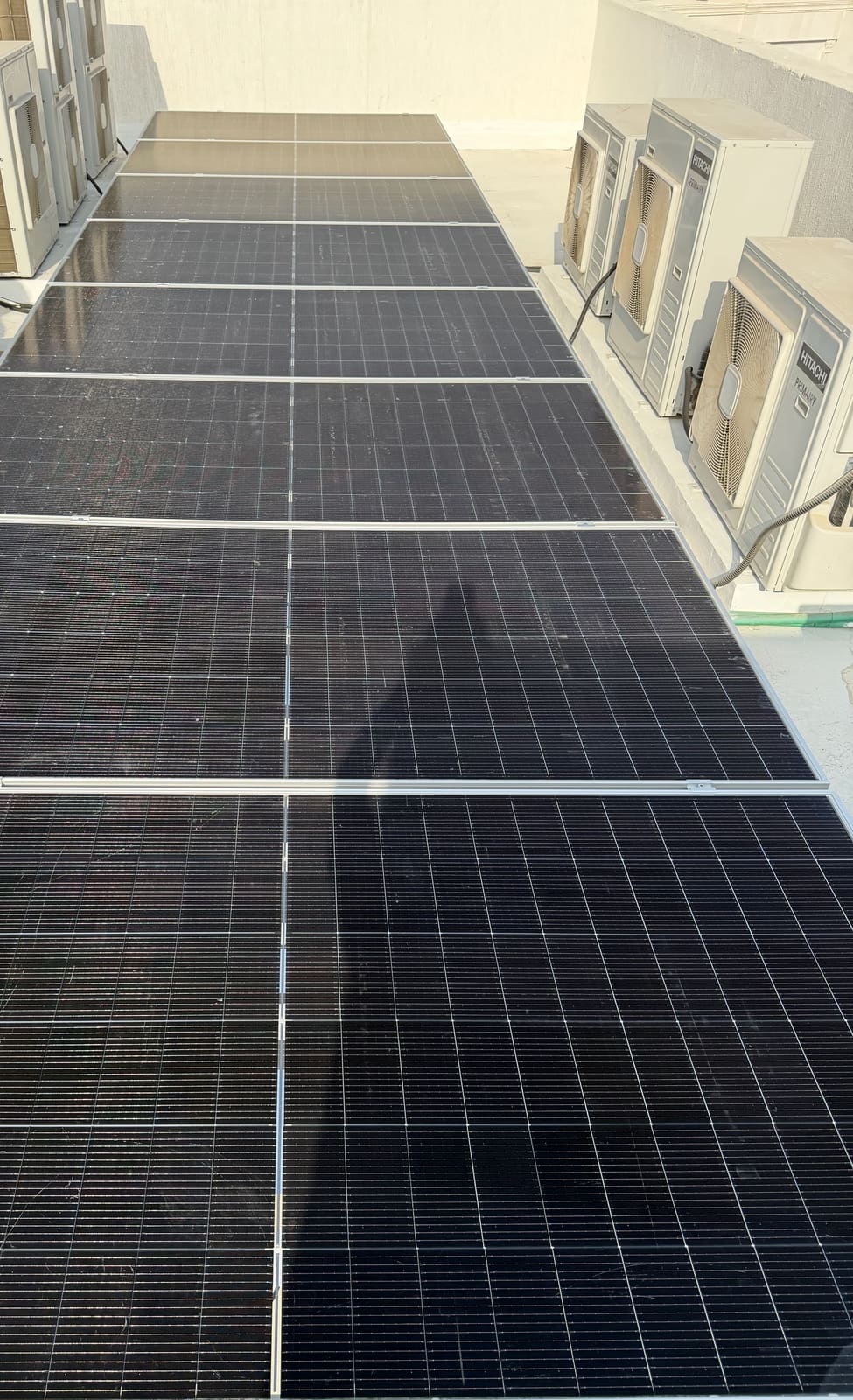 Solar panels running the length of a villa roof, Ajman